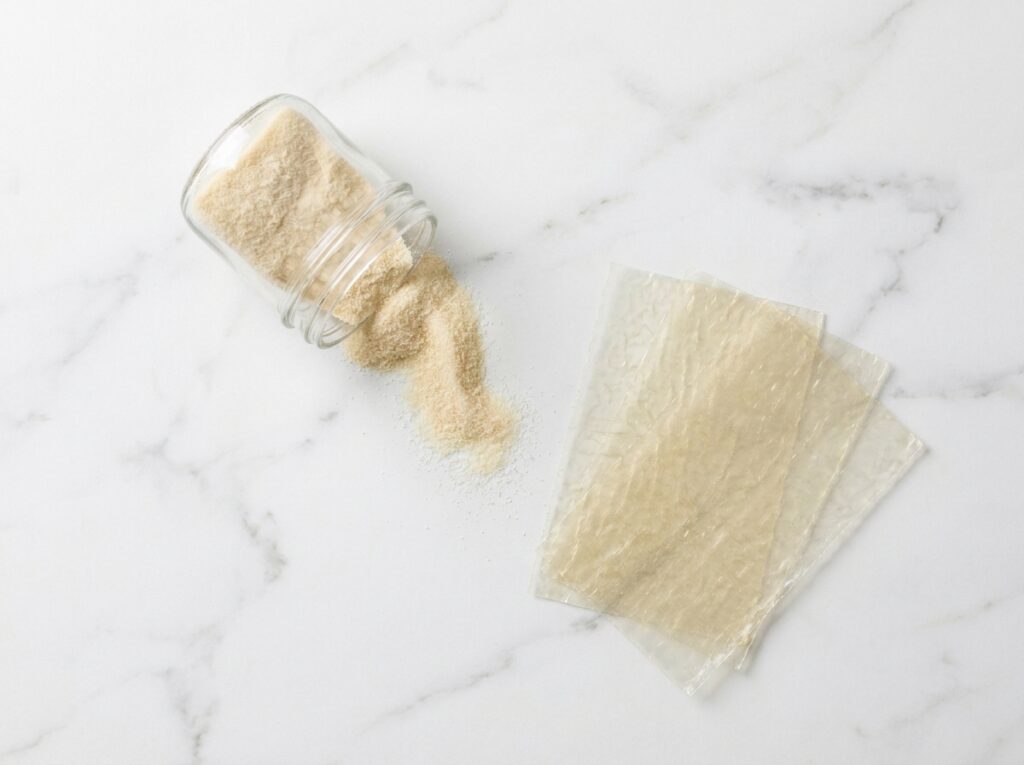 unflavored gelatin powder scattered on white Carrara marble