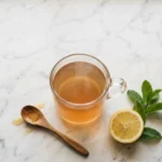 Gelatin water recipe in a glass mug on marble countertop